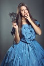 Beautiful woman with blue dress and black mask Royalty Free Stock Photo