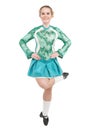 Beautiful woman in blue dress for Irish dance jumping isolated Royalty Free Stock Photo