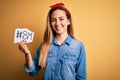 Beautiful woman with blue eyes celebrating 8th march womens day over yellow background with a happy face standing and smiling with