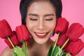 Beautiful woman with bouquet of red tulip flowers Royalty Free Stock Photo