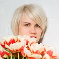 Beautiful woman with a bouquet of roses Royalty Free Stock Photo