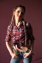 Beautiful fashionable woman braids in country shirt Royalty Free Stock Photo