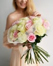 Beautiful woman bride hold bouquet of white and pink roses flowers happy smiling Royalty Free Stock Photo