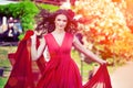 Beautiful woman in a bright red dress