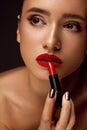 Beautiful Woman With Bright Red Lips And Lipstick In Hand Royalty Free Stock Photo