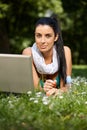 Beautiful woman browsing internet in citypark