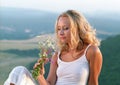 Beautiful woman with bunch of wildflowers Royalty Free Stock Photo