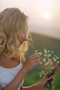 Beautiful woman with bunch of wildflowers Royalty Free Stock Photo