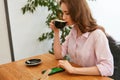 Beautiful Woman In Cafe Drinking Coffee Royalty Free Stock Photo