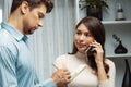 Woman calling to customer taking note by coworker with business. Postulate. Royalty Free Stock Photo