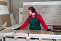Beautiful woman carpenter beginning job in carpentry Royalty Free Stock Photo