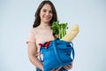 Beautiful woman carrying grocery bag Royalty Free Stock Photo