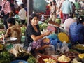Intriguing, Seated Woman at Outdoor Market in Cambodia