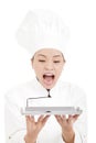 Beautiful woman chef screaming and holding tray Royalty Free Stock Photo