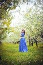 Beautiful woman in a cherry orchard