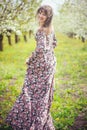 Beautiful woman in a cherry orchard