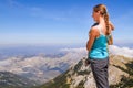 Beautiful woman and child look at the beautiful mountains in National park Lovcen, Montenegro