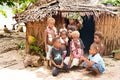 Beautiful woman with children in front of straw hut, Nemba, Utupua, Solomon Islands, South Pacific Islands