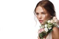 Beautiful woman with classic nude make-up, light hairstyle and flowers. Beauty face. Royalty Free Stock Photo