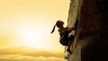 Beautiful Woman Climbing on the Rock at Foggy Sunset in the Mountains. Adventure and Extreme Sport Concept Royalty Free Stock Photo