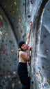 Beautiful Woman Climbing on the climbing wall. Adventure and Extreme Sport Concept Royalty Free Stock Photo