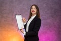 Beautiful woman with clipboard offering sign a contract with pen Royalty Free Stock Photo