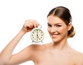 Beautiful woman with clock close up, smiling