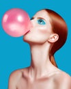 Beautiful woman close up with a bubble gum, high-quality beauty Royalty Free Stock Photo