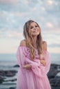 Beautiful Woman on Coastline. Outdoors Portrait of Blonde