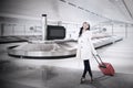 Beautiful woman collect luggage at airport