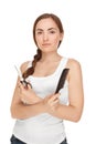 Beautiful woman with comb and sissors (focus on woman) Royalty Free Stock Photo