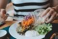 Beautiful woman cooking in new kitchen making healthy food with vegetables Royalty Free Stock Photo