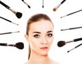 Beautiful woman with cosmetic brushes isolated Royalty Free Stock Photo