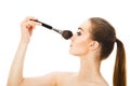 Beautiful woman with cosmetic brushes isolated