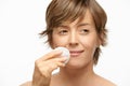 Beautiful woman with cotton pad, wiping off make up Royalty Free Stock Photo