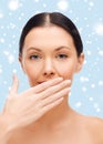 Beautiful woman covering her mouth Royalty Free Stock Photo