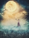 Beautiful woman with crow on the rock against spooky sky. Hallow