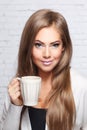 Beautiful woman with a cup of hot drink