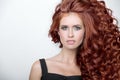 Beautiful woman with curly red thick hair. Face closeup portrait Royalty Free Stock Photo