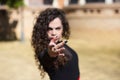 Beautiful woman dancing flamenco in Seville, Spain. The woman points with defiant and passionate look at the camera. Focus on hand Royalty Free Stock Photo