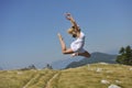 Beautiful woman dancing in nature