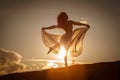 Beautiful woman dancing at sunset Royalty Free Stock Photo