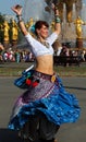 Beautiful woman dansing at Cosplay festival on a background of the fountain Friendship of Nations Royalty Free Stock Photo