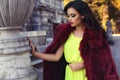 Beautiful woman with dark hair in luxurious fashion fur coat Royalty Free Stock Photo