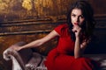 Beautiful woman with dark hair wearing elegant red dress Royalty Free Stock Photo