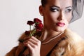 Beautiful woman with dark red roses Royalty Free Stock Photo