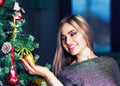 Beautiful woman decorating christmass tree Royalty Free Stock Photo