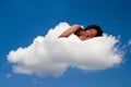 Beautiful woman deeply asleep and dreaming on Cloud nine Royalty Free Stock Photo