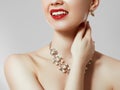 Beautiful woman with diamond necklace. Young beauty model with diamond pendant and earrings. Jewellery and accessories Royalty Free Stock Photo