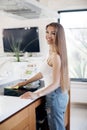 Beautiful woman doing cleaning at home at kitchen Royalty Free Stock Photo